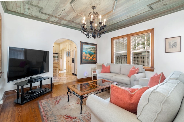 living room with wooden ceiling, crown molding, hardwood / wood-style floors, and a notable chandelier