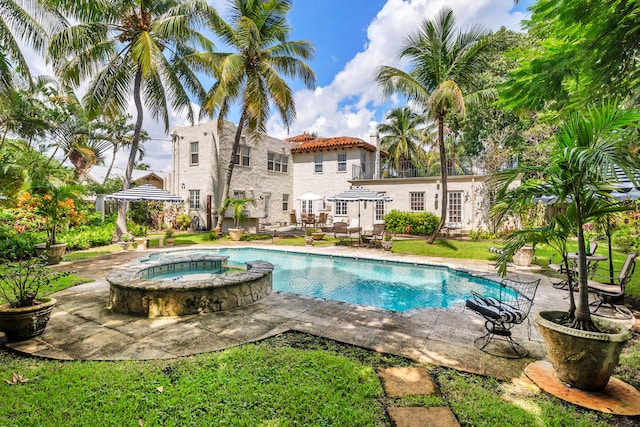 view of swimming pool with an in ground hot tub, a patio area, and a gazebo