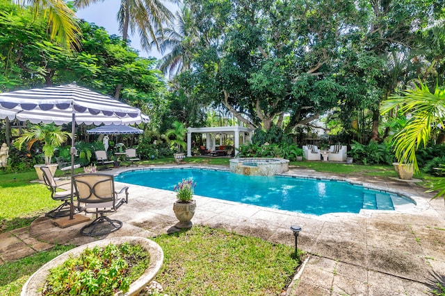 view of swimming pool with an in ground hot tub and a patio area