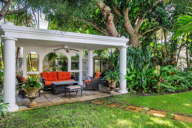 view of yard with a patio, outdoor lounge area, and ceiling fan