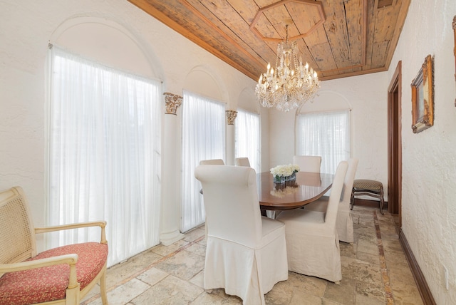 dining room with ornamental molding, a chandelier, and wooden ceiling