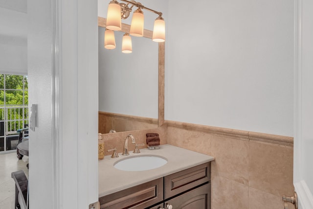 bathroom featuring tile walls and vanity