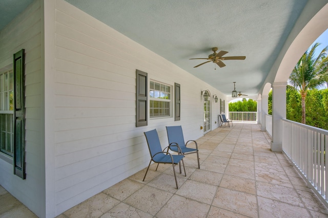 view of patio / terrace featuring ceiling fan