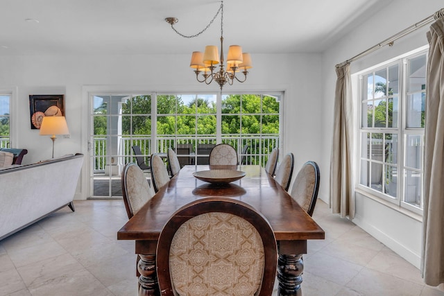 dining space featuring a chandelier