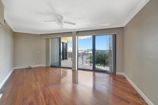 unfurnished room featuring crown molding, hardwood / wood-style floors, and ceiling fan