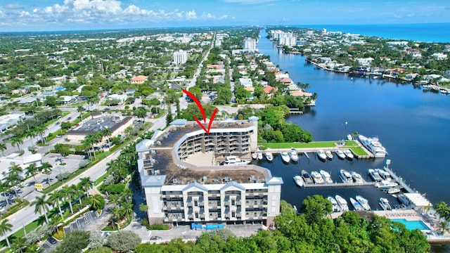 birds eye view of property featuring a water view