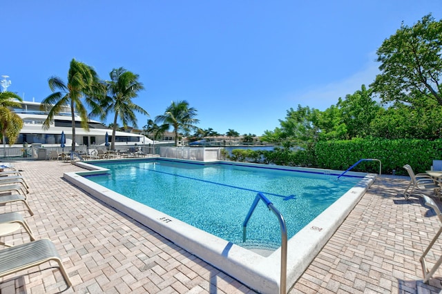 view of swimming pool with a patio area