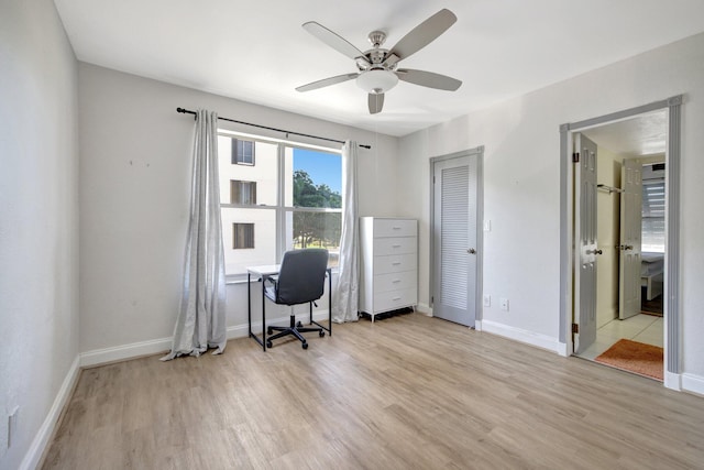 home office featuring ceiling fan and light hardwood / wood-style flooring