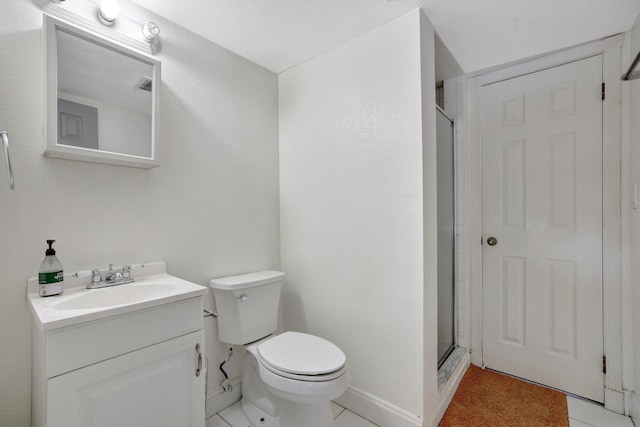 bathroom with walk in shower, vanity, and toilet