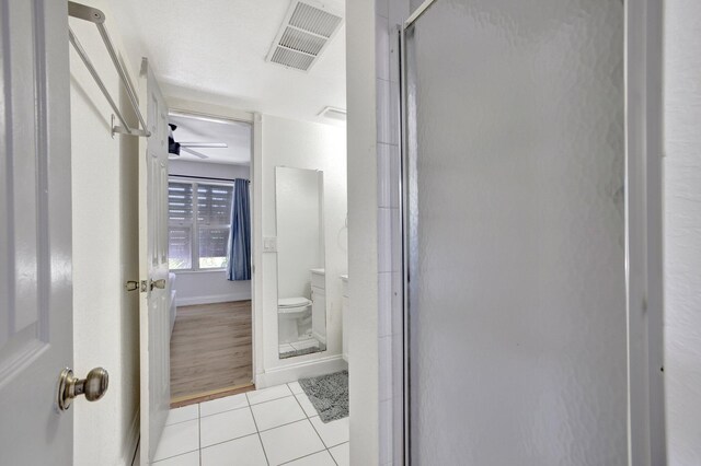 bedroom with wood-type flooring and ceiling fan