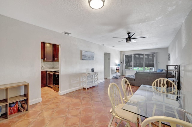 dining room with ceiling fan and a textured ceiling