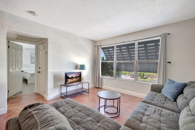 tiled living room with a textured ceiling