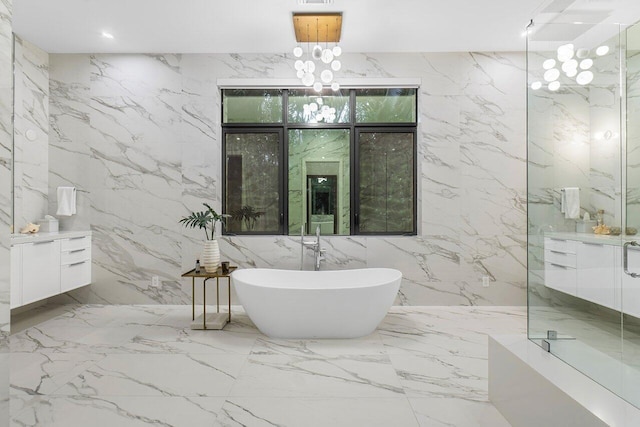 bathroom with independent shower and bath, vanity, and tile walls