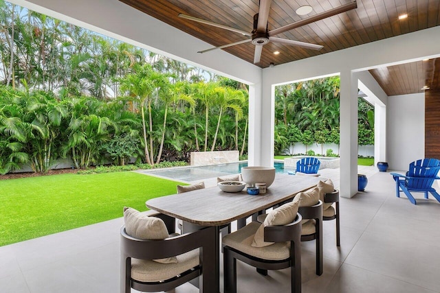 view of pool featuring an in ground hot tub, a yard, a patio area, and pool water feature