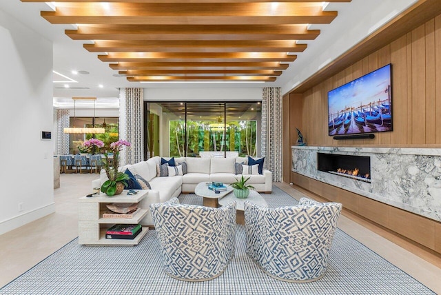 living room with wood ceiling, a large fireplace, and ceiling fan