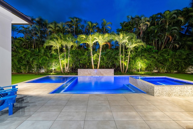 view of swimming pool with a patio and an in ground hot tub