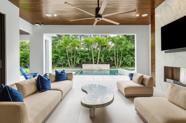 living room with indoor wet bar and beam ceiling