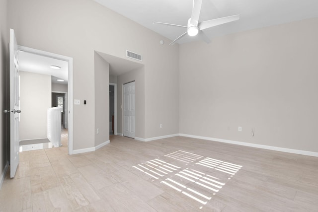 unfurnished room with light hardwood / wood-style flooring and ceiling fan