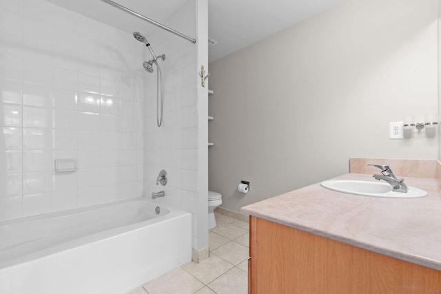 full bathroom featuring tile patterned floors, vanity, tiled shower / bath combo, and toilet