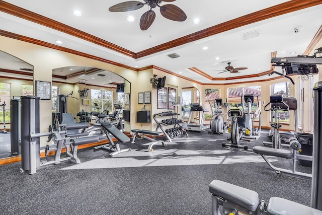 exercise room with ornamental molding, ceiling fan, and a healthy amount of sunlight