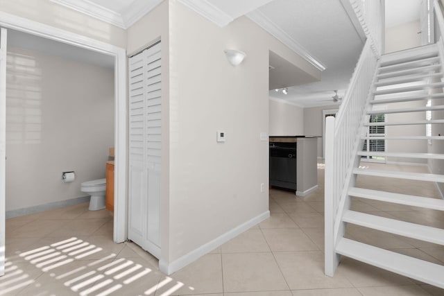 interior space featuring tile patterned floors and ornamental molding