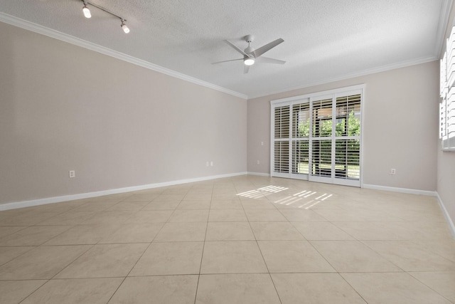 tiled empty room featuring a textured ceiling, ceiling fan, and crown molding