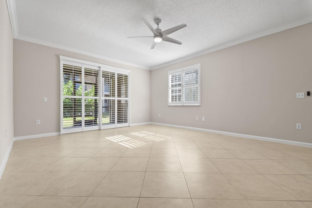 tiled empty room featuring ceiling fan, ornamental molding, and a textured ceiling