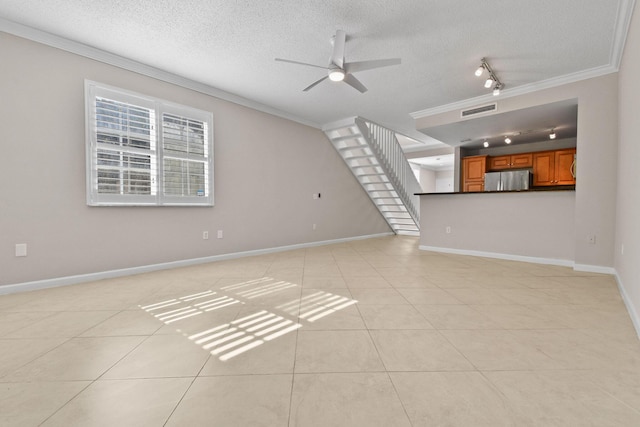 unfurnished living room featuring ceiling fan, crown molding, and light tile patterned flooring