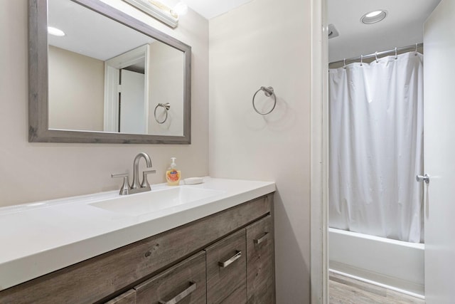 bathroom featuring shower / bath combo, vanity, and hardwood / wood-style floors