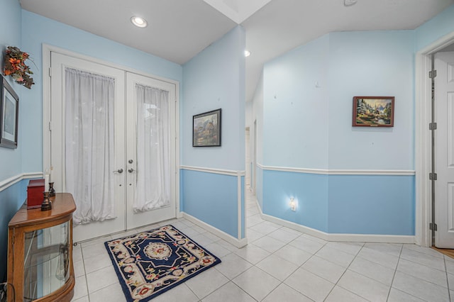 foyer with light tile patterned floors