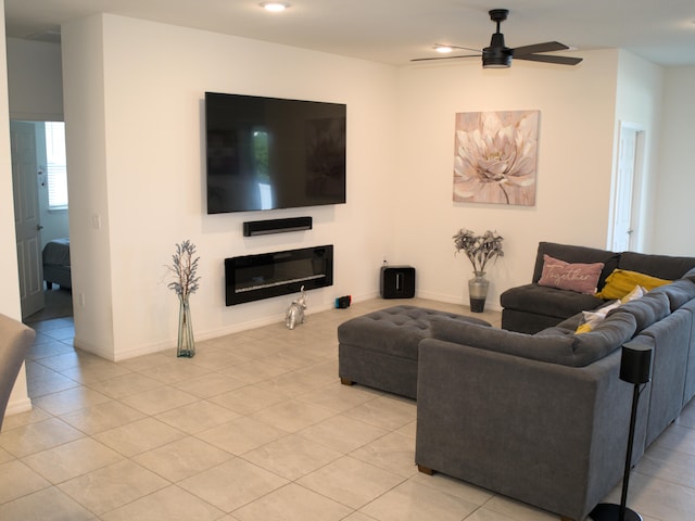 tiled living room featuring ceiling fan