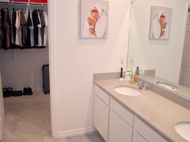 bathroom with vanity and tile patterned flooring