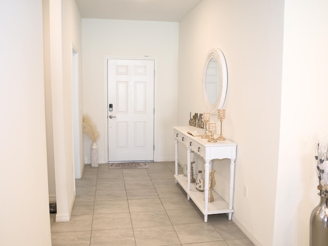 hallway featuring light tile patterned floors