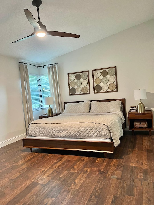 bedroom with dark wood-type flooring and ceiling fan