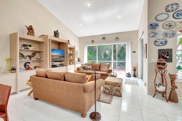 living room with high vaulted ceiling and light tile patterned flooring