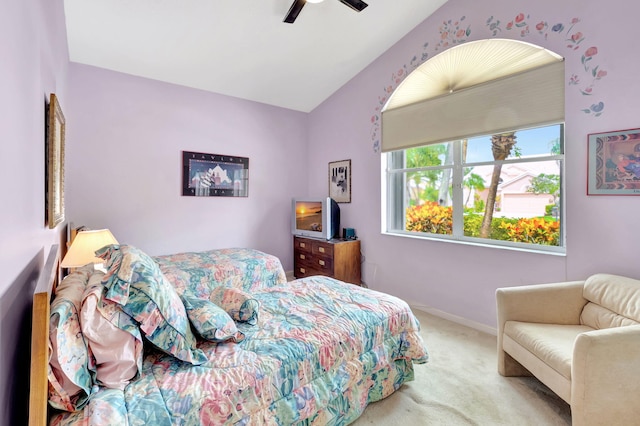 carpeted bedroom featuring lofted ceiling and ceiling fan