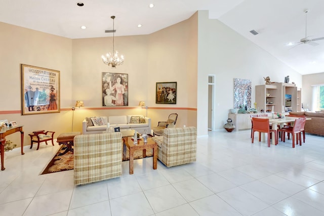 tiled living room with ceiling fan with notable chandelier and high vaulted ceiling