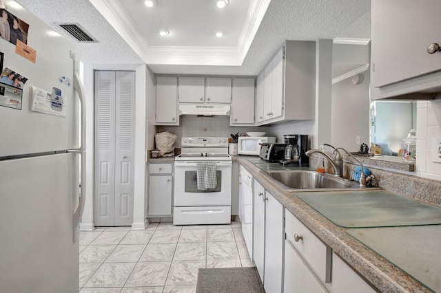 kitchen featuring a textured ceiling, crown molding, sink, and white appliances