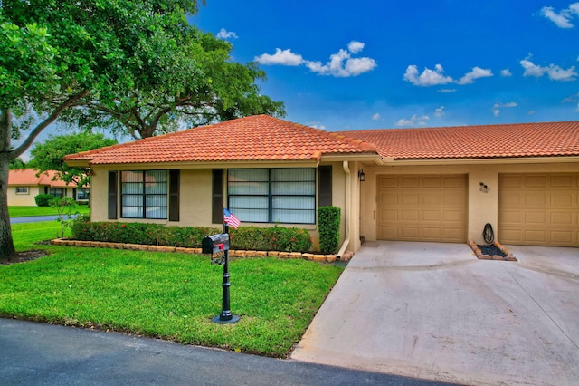 single story home with a front yard and a garage