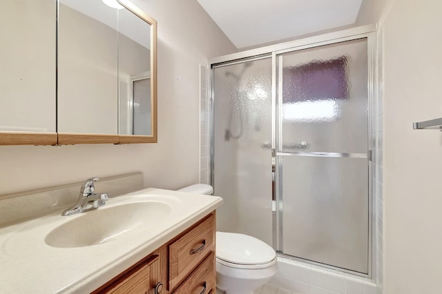 bathroom featuring tile patterned flooring, an enclosed shower, vanity, and toilet