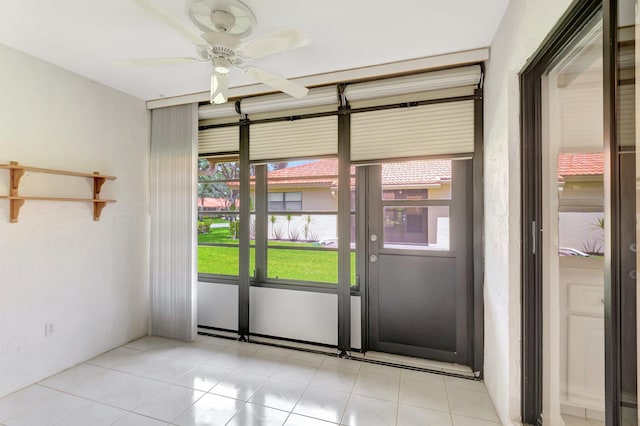 doorway to outside with ceiling fan and a healthy amount of sunlight