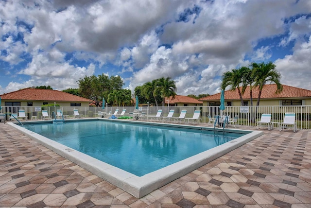 view of swimming pool with a patio