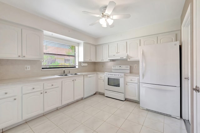 kitchen with light tile patterned flooring, sink, white cabinets, white appliances, and ceiling fan