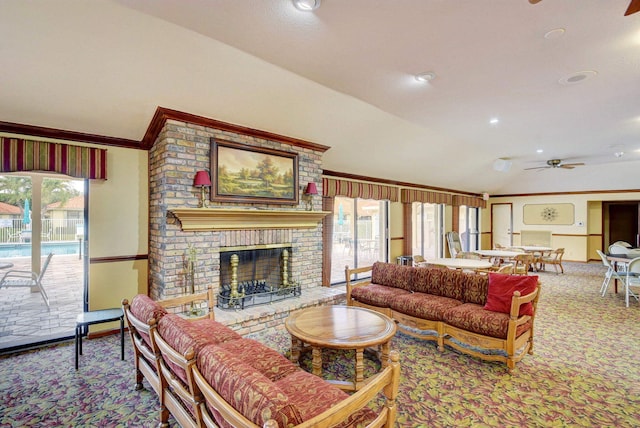 living room with carpet floors, a fireplace, ceiling fan, and a wealth of natural light