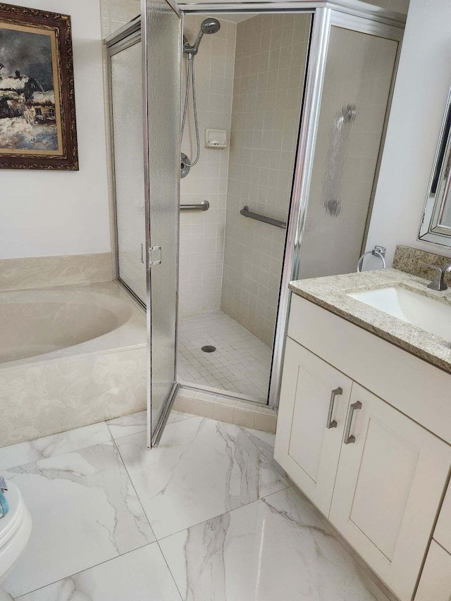 bathroom with vanity and separate shower and tub