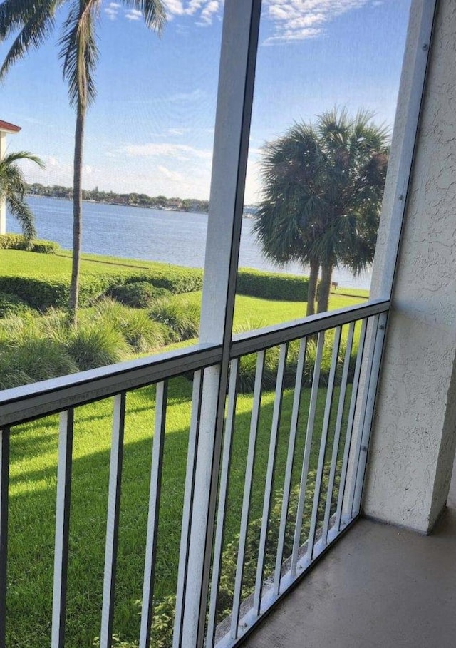 balcony featuring a water view