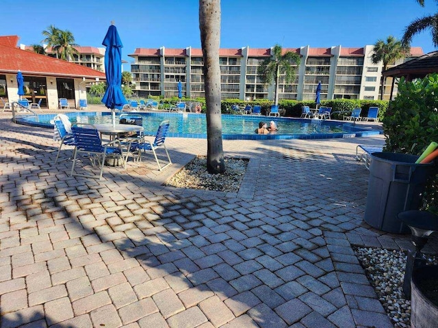 view of swimming pool featuring a patio