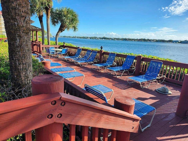 wooden deck with a water view