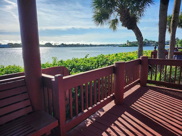 wooden deck with a water view