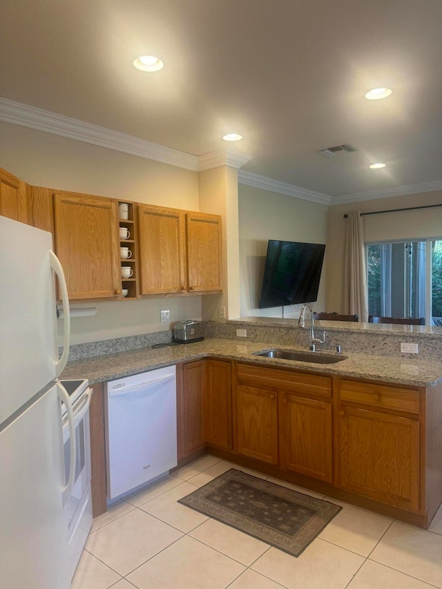 kitchen featuring light stone counters, white appliances, light tile patterned floors, ornamental molding, and sink